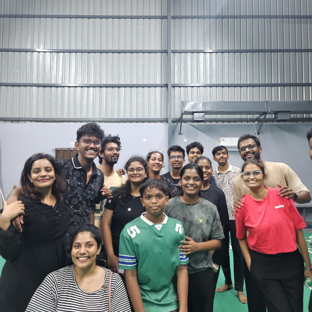 Rooted community group photo after a badminton night
